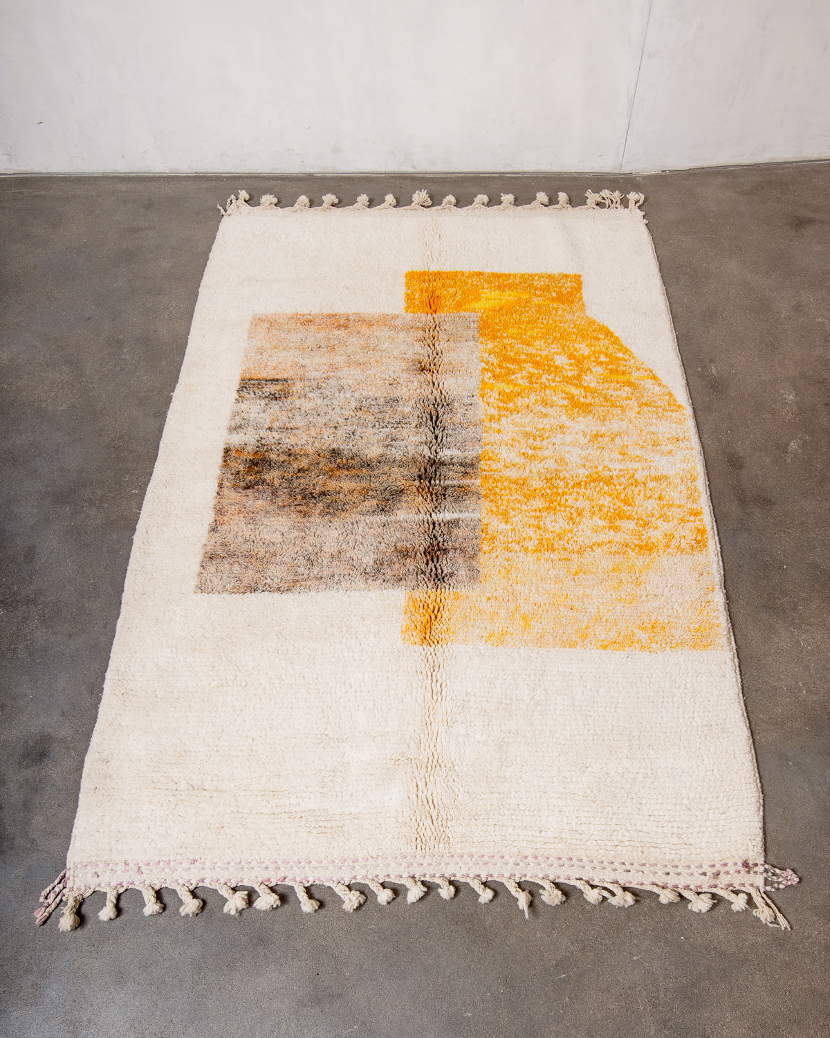 Modern, designer, handcrafted Berber rug from Morocco. Beniourain carpet with beautiful colours and patterns and fluffy wool texture.